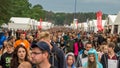 Kostrzyn nad OdrÃâ¦, Poland - July 15, 2016: people walking between the commercial tents at the Przystanek Woodstock Royalty Free Stock Photo